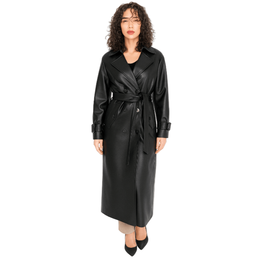 Woman wearing a black leather trench coat on a white background